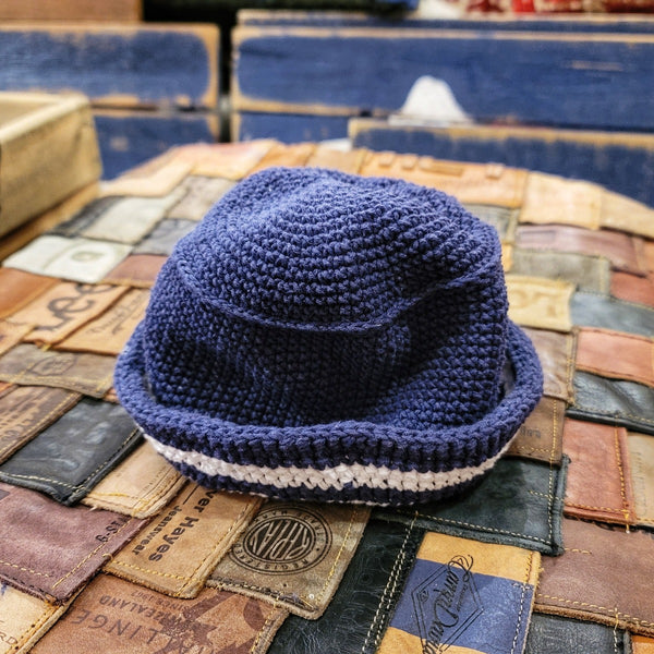 crocheted blue hat with white border stripe